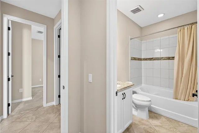 a view of a house with swimming pool and a yard