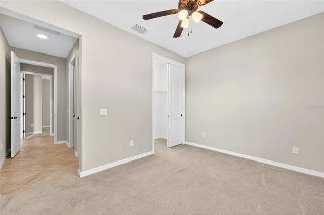 a view of swimming pool with a lounge chairs
