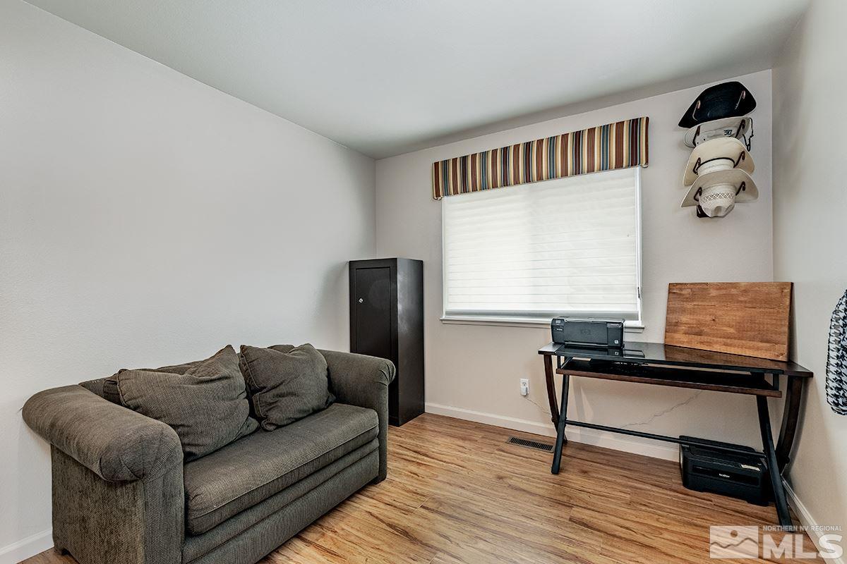 734 Gold River Court Reno, NV 89521 - Photo 12 of 21 a living room with furniture and a wooden floor