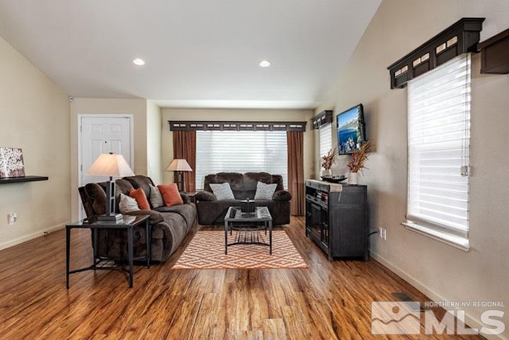 734 Gold River Court Reno, NV 89521 - Photo 3 of 21 a living room with furniture and a wooden floor