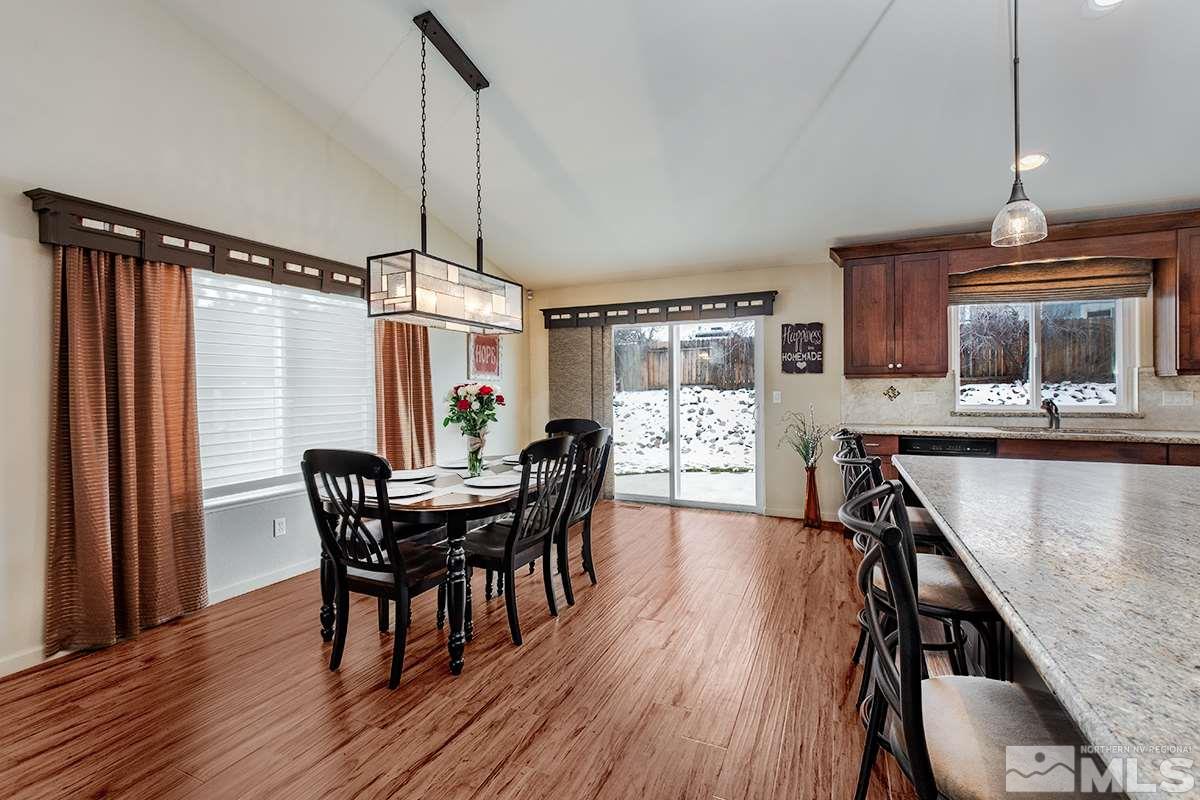 734 Gold River Court Reno, NV 89521 - Photo 4 of 21 a view of a dining room with furniture window and wooden floor