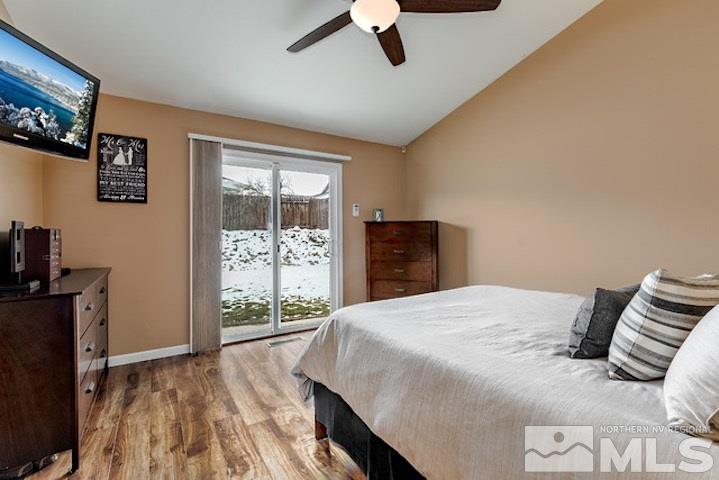 734 Gold River Court Reno, NV 89521 - Photo 10 of 21 a bedroom with a bed and wooden floor