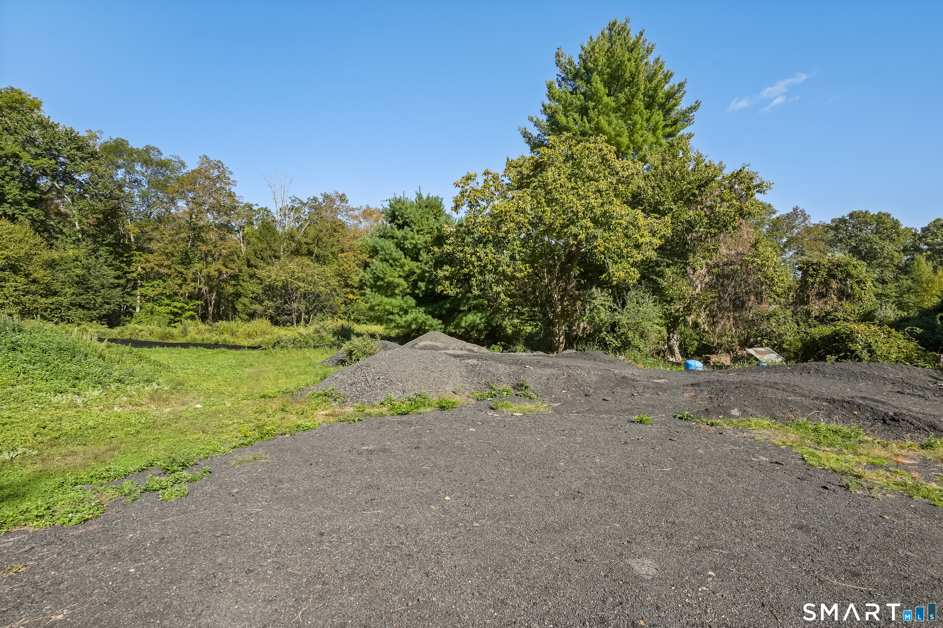 96 Georgetown Road Weston, CT 06883 - Photo 3 of 18 a view of a yard with a tree