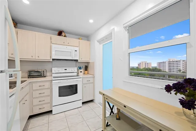 a kitchen with cabinets and appliances