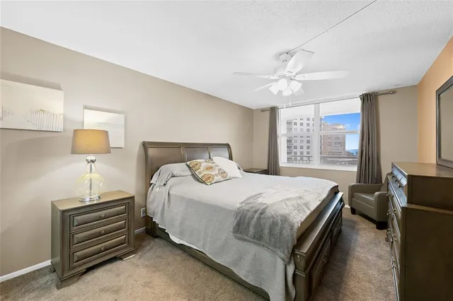 a bedroom with a bed and a table