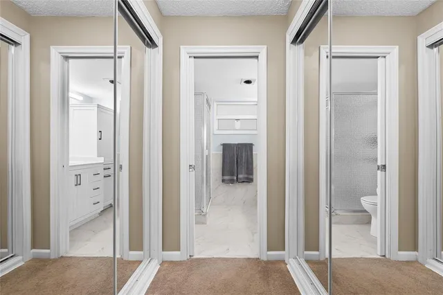 a view of a bathroom from a hallway