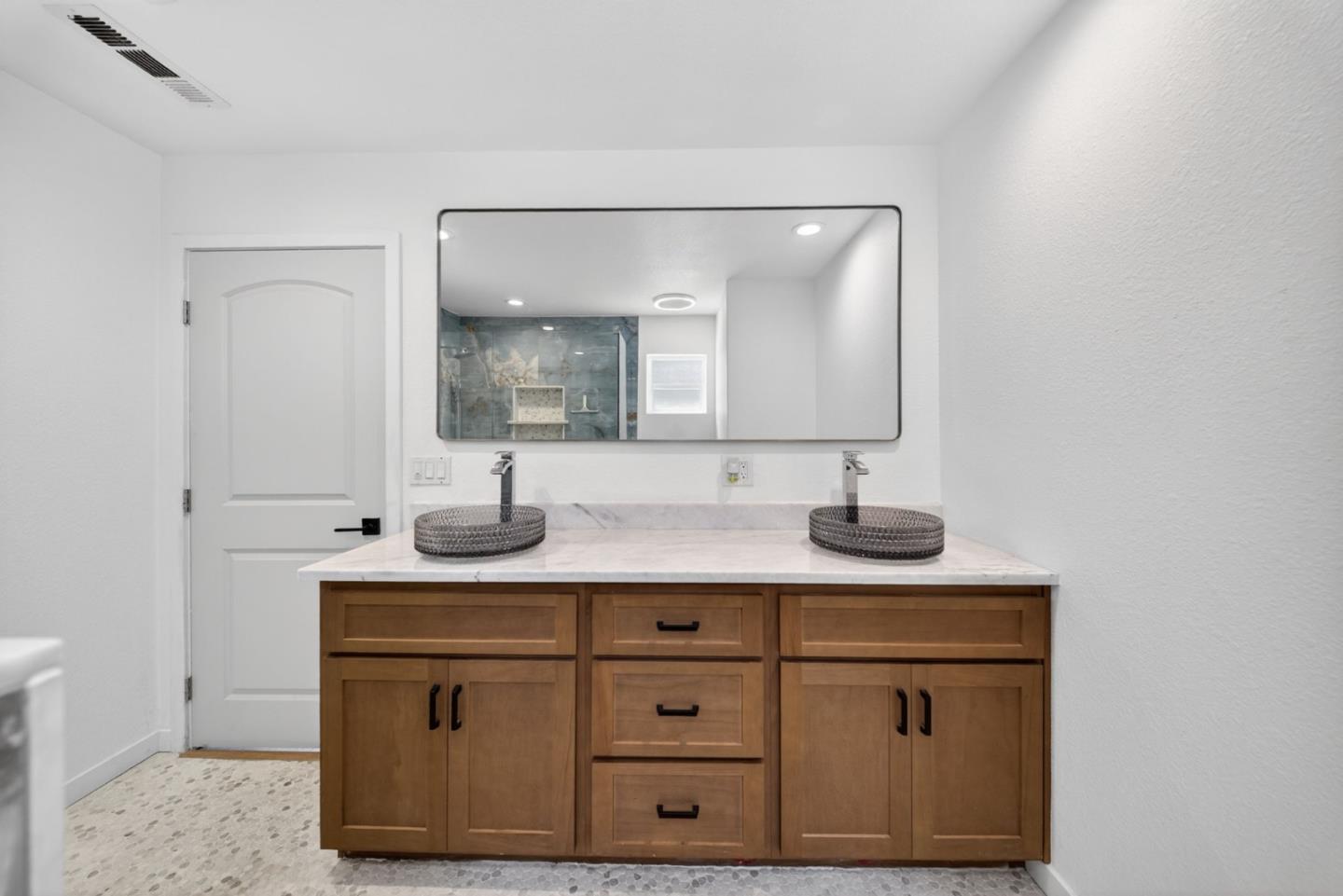 919 Old Canyon Road Fremont, CA 94536 - Photo 44 of 55 a bathroom with a sink vanity and mirror