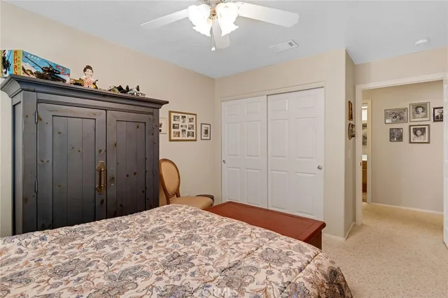 a bedroom with a bed and a dresser in it