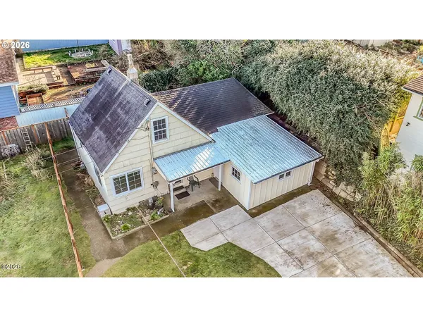 a aerial view of a house with a yard
