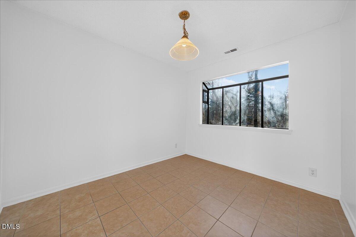 3088 Colony Road, Unit 3088D Durham, NC 27705 - Photo 9 of 25 a view of an empty room with a window