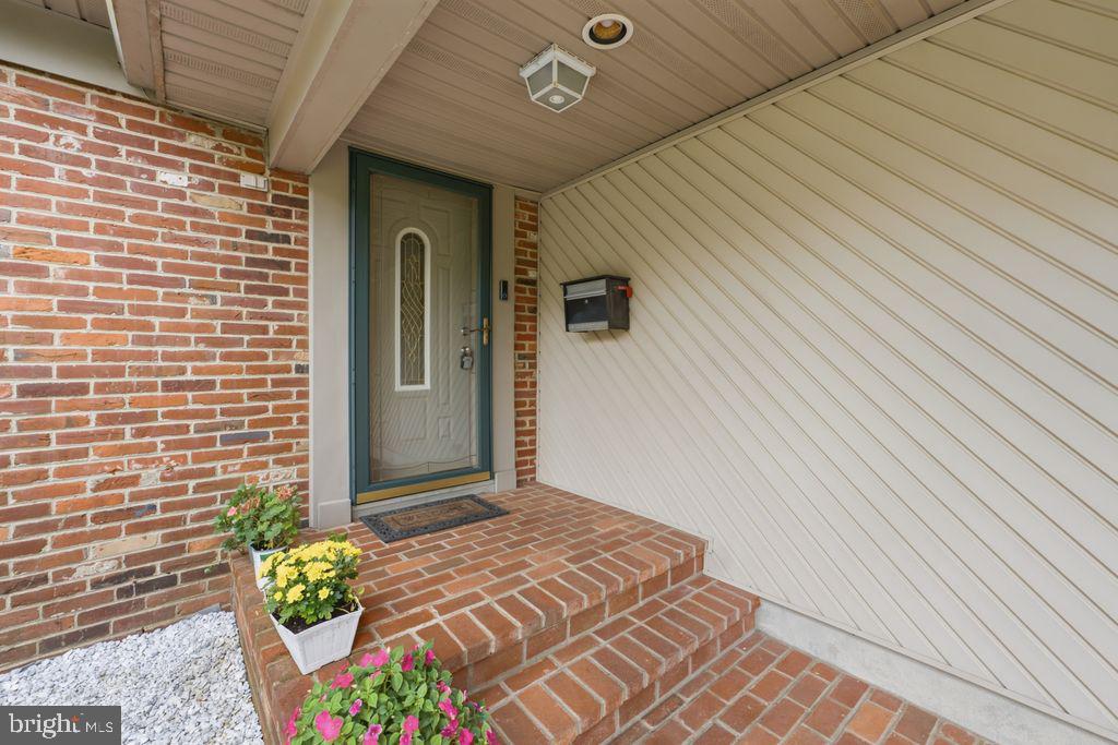 557 Covered Bridge Road Cherry Hill, NJ 08034 - Photo 3 of 43 Charming entryway with vibrant blooms.
