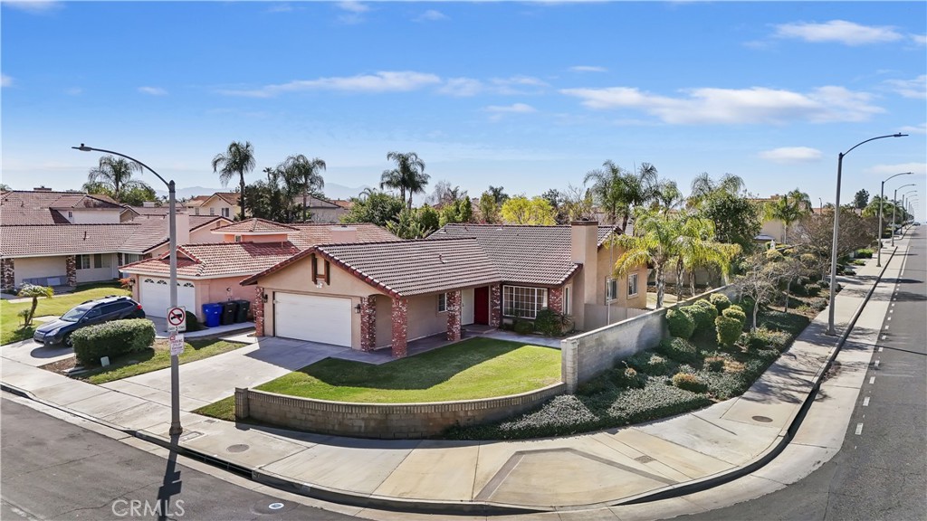 8605 Barton Street Riverside, CA 92508 - Photo 1 of 1 a view of a house with a garden and plants