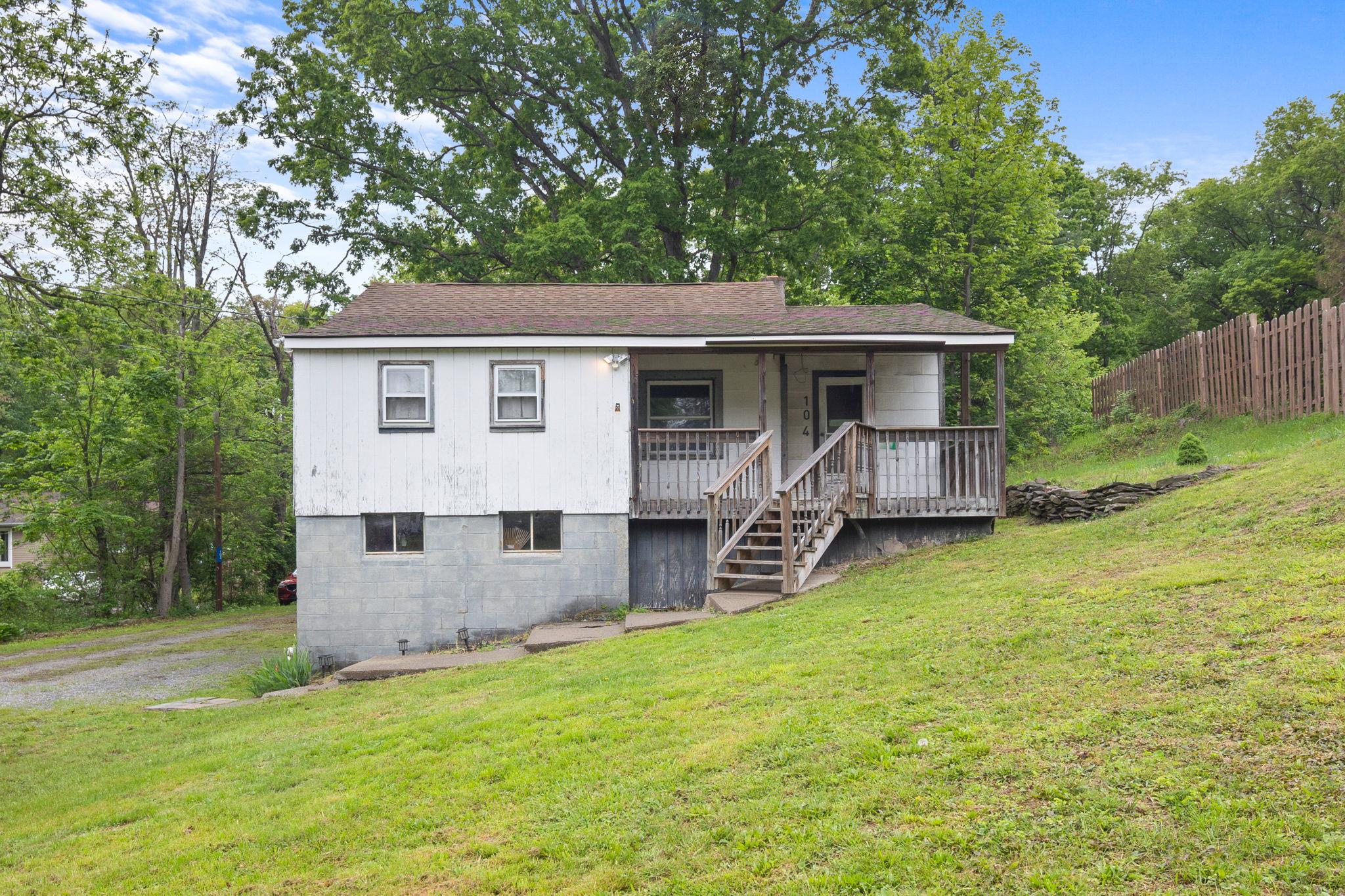 Front of House featuring a porch and stairs