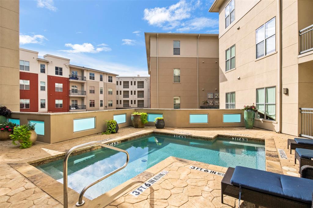 2950 McKinney Avenue, Unit 412 Dallas, TX 75204 - Photo 25 of 26 a view of a house with a swimming pool