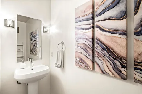 a bathroom with a sink and mirror