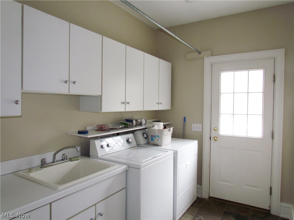 10780 Bell Road Newbury, OH 44065 - Photo 23 of 31 First floor laundry room with washer and dryer. Access to deck