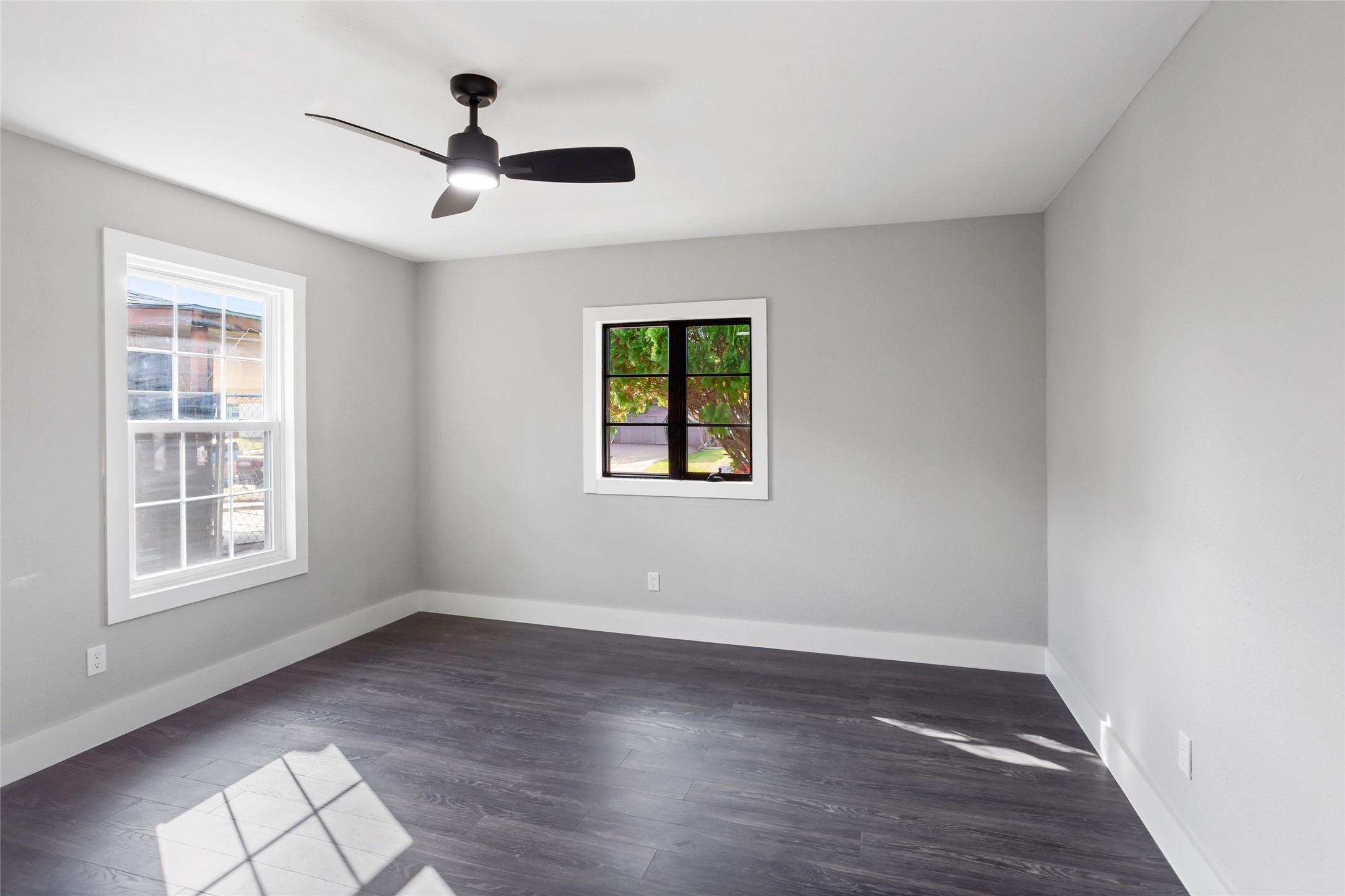 12707 Southbridge Road Houston, TX 77047 - Photo 12 of 23 a view of an empty room with wooden floor and a window