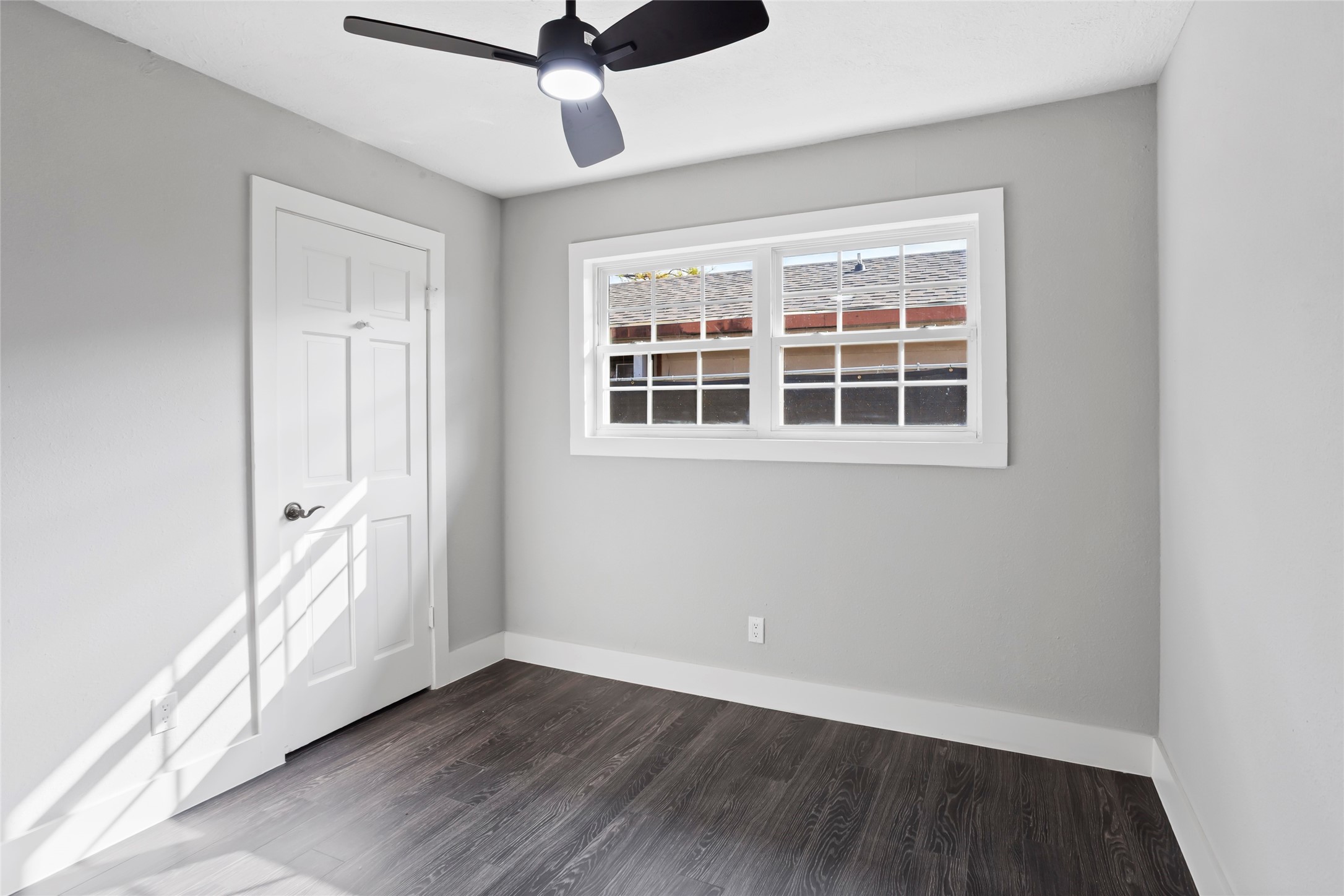 12707 Southbridge Road Houston, TX 77047 - Photo 15 of 23 a view of an empty room with wooden floor and a window