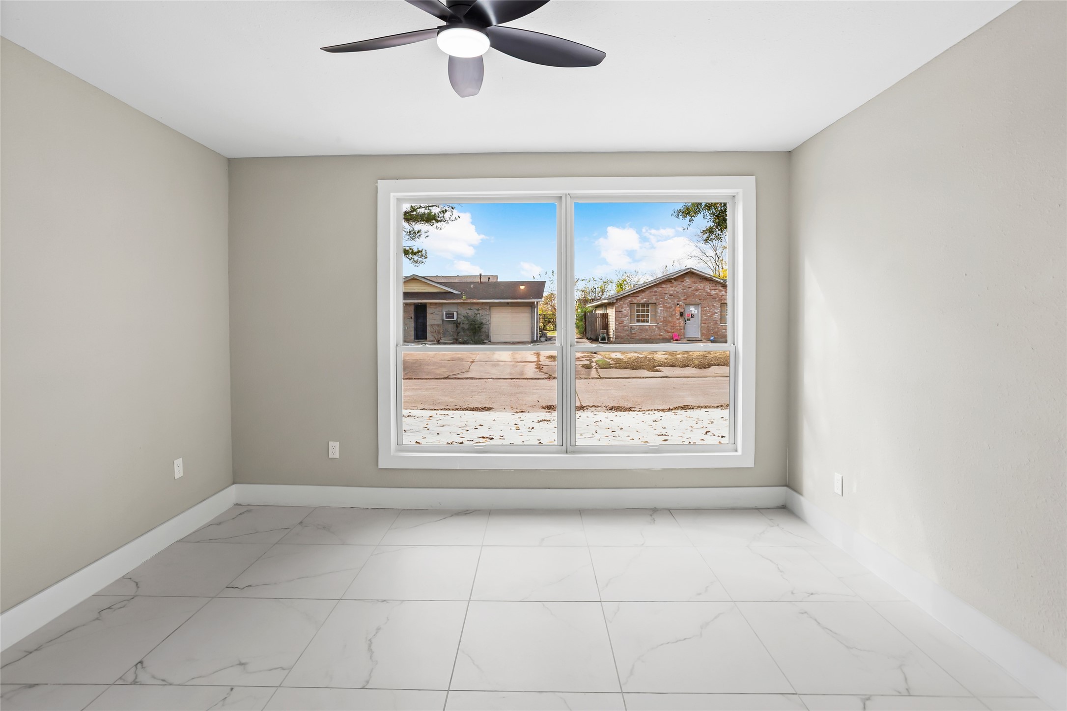 12707 Southbridge Road Houston, TX 77047 - Photo 5 of 23 a view of an empty room with a window