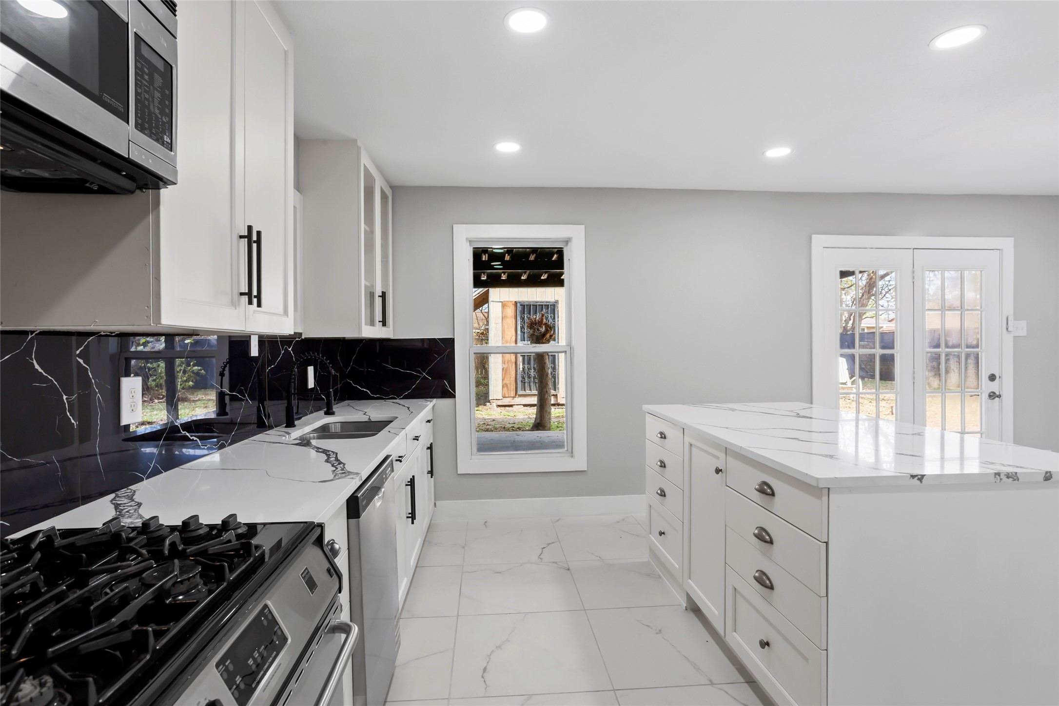 12707 Southbridge Road Houston, TX 77047 - Photo 9 of 23 a kitchen with a stove and a sink