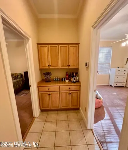 a kitchen with a stove a sink and a refrigerator