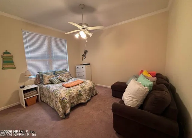a bedroom with a bed and couch