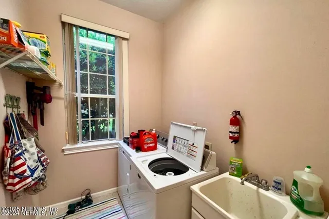 a bathroom with a toilet and a shower curtain