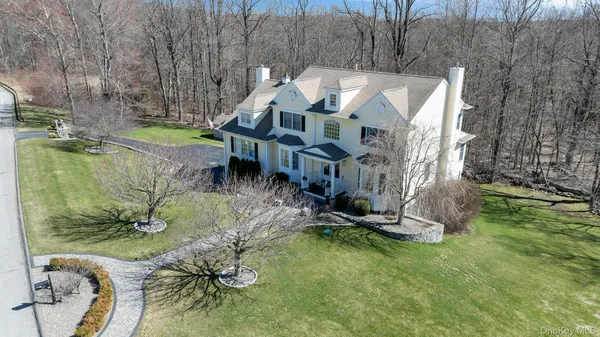 an aerial view of a house with a yard