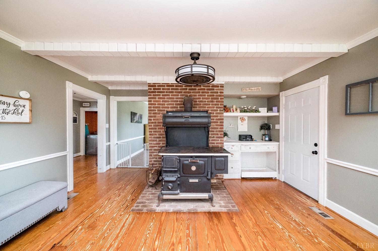 1103 Manley Branch Road Concord, VA 24538 - Photo 15 of 56 a living room with furniture a fireplace and a table