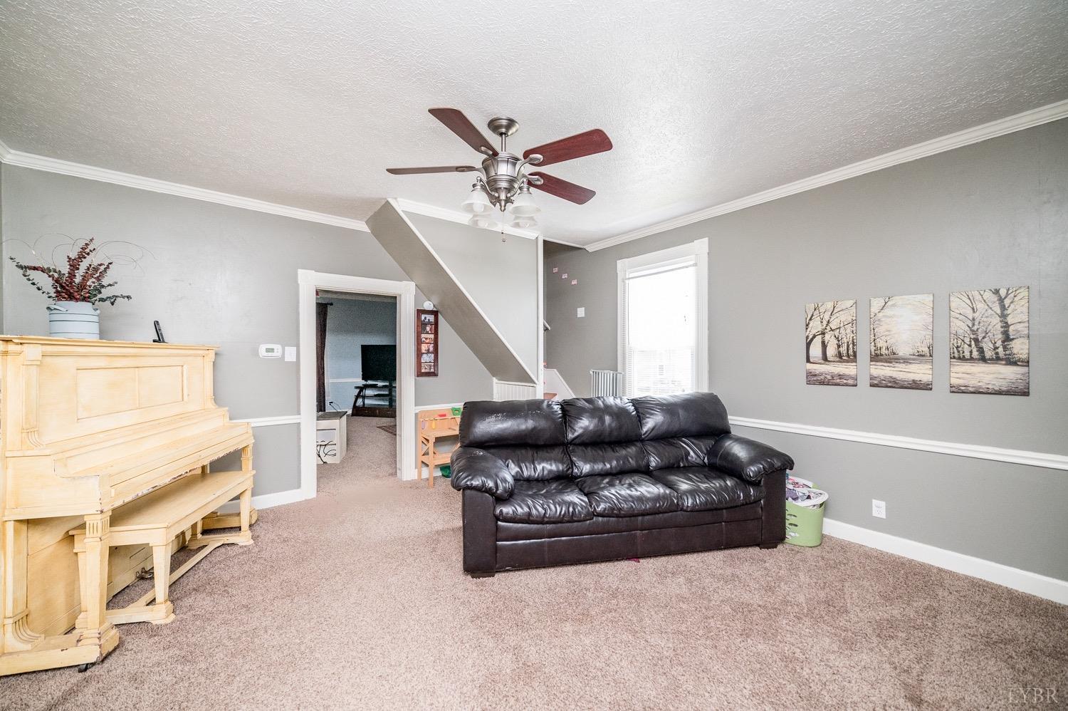 1103 Manley Branch Road Concord, VA 24538 - Photo 19 of 56 a living room with furniture and a ceiling fan