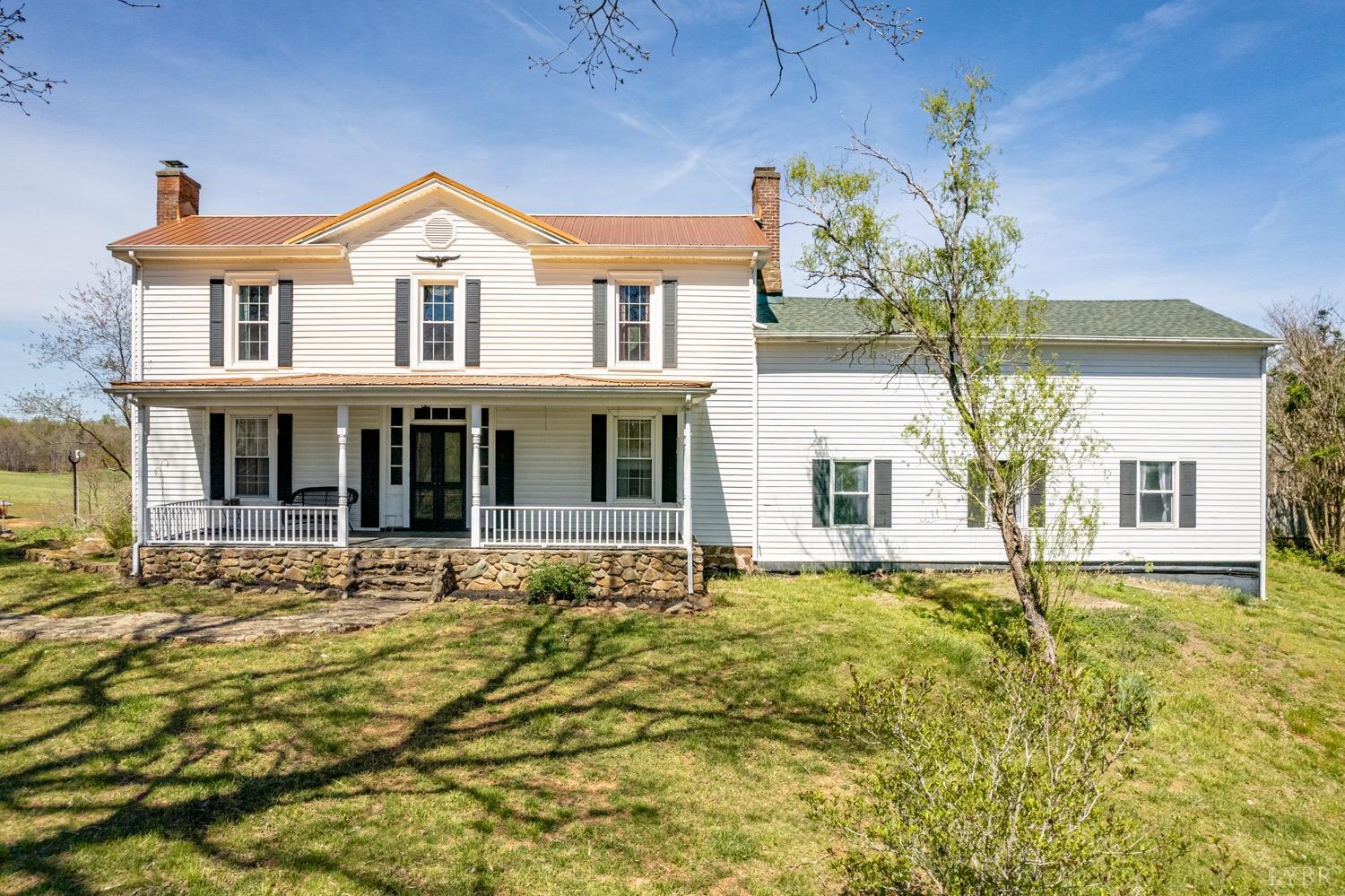 1103 Manley Branch Road Concord, VA 24538 - Photo 2 of 56 a front view of a house with a garden