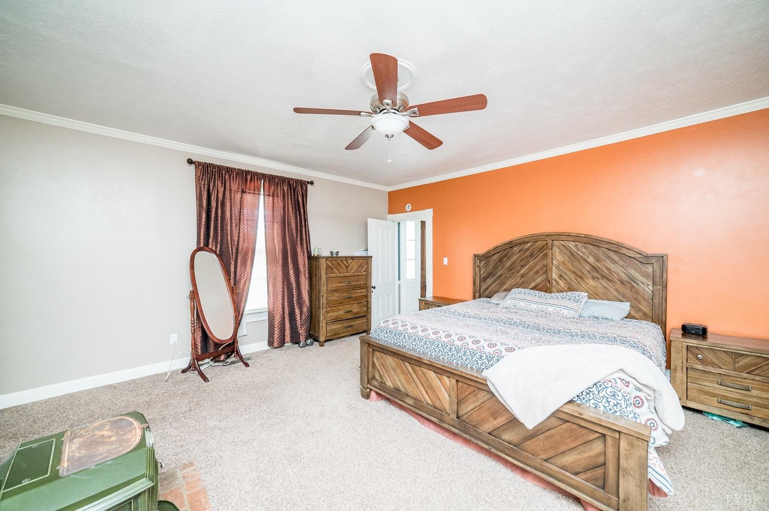 1103 Manley Branch Road Concord, VA 24538 - Photo 28 of 56 a bedroom with a bed and a chandelier