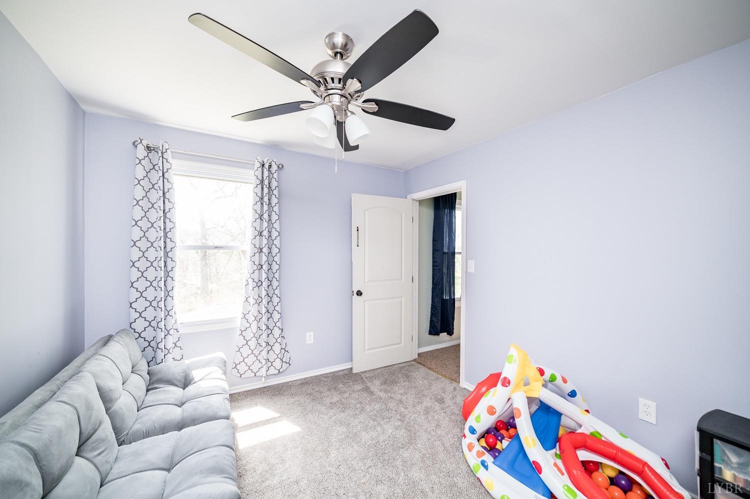 1103 Manley Branch Road Concord, VA 24538 - Photo 35 of 56 a bedroom with furniture and a window