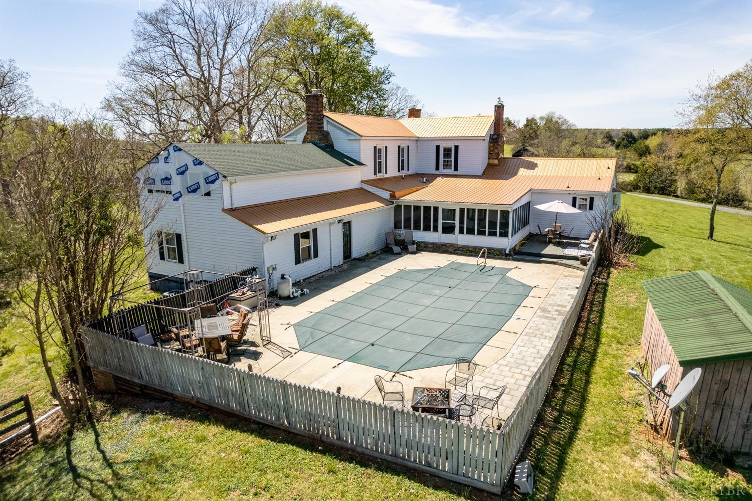1103 Manley Branch Road Concord, VA 24538 - Photo 48 of 56 a view of a house with swimming pool and sitting area