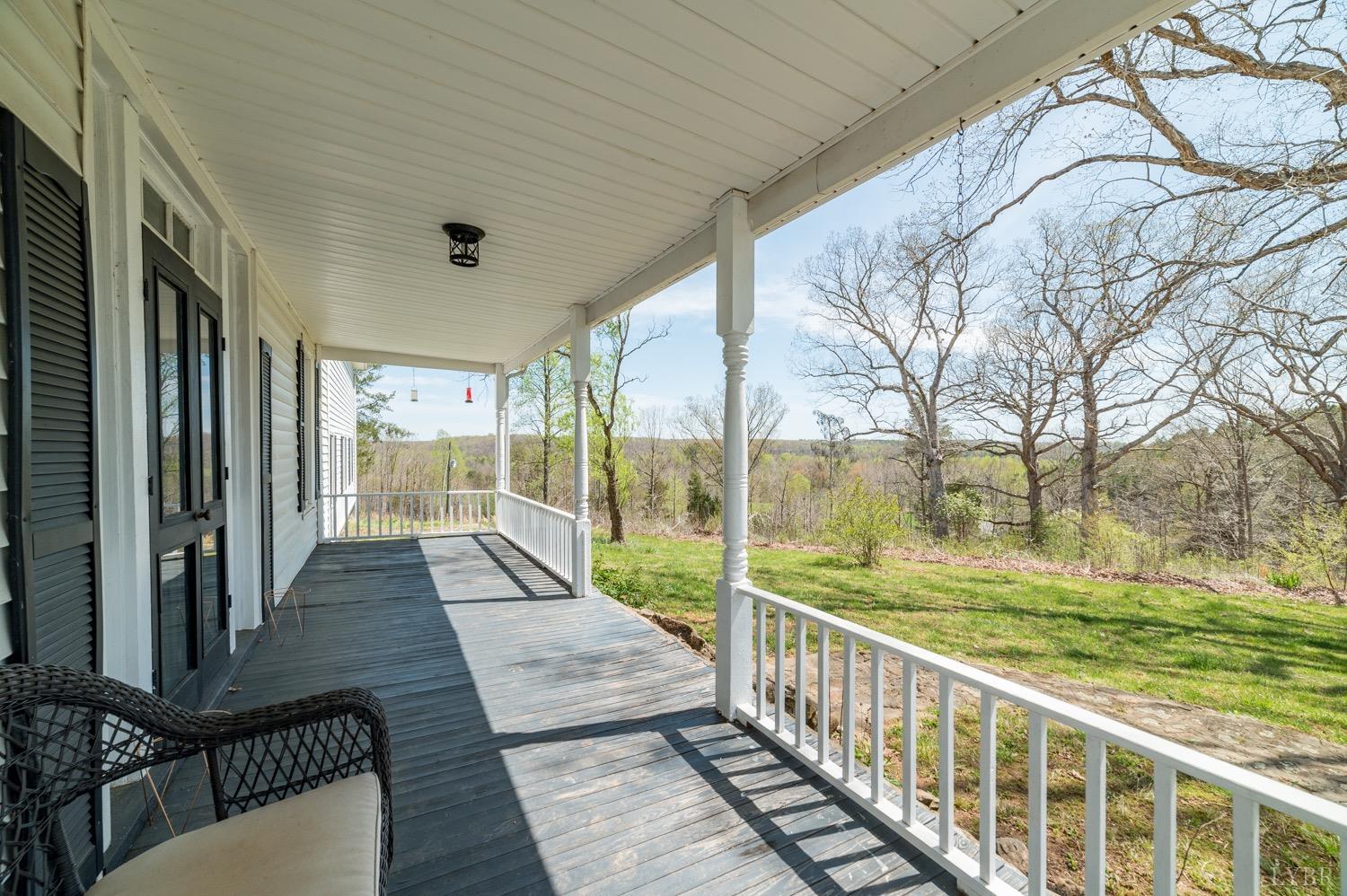 1103 Manley Branch Road Concord, VA 24538 - Photo 49 of 56 a view of balcony with floor to ceiling windows and wooden floor