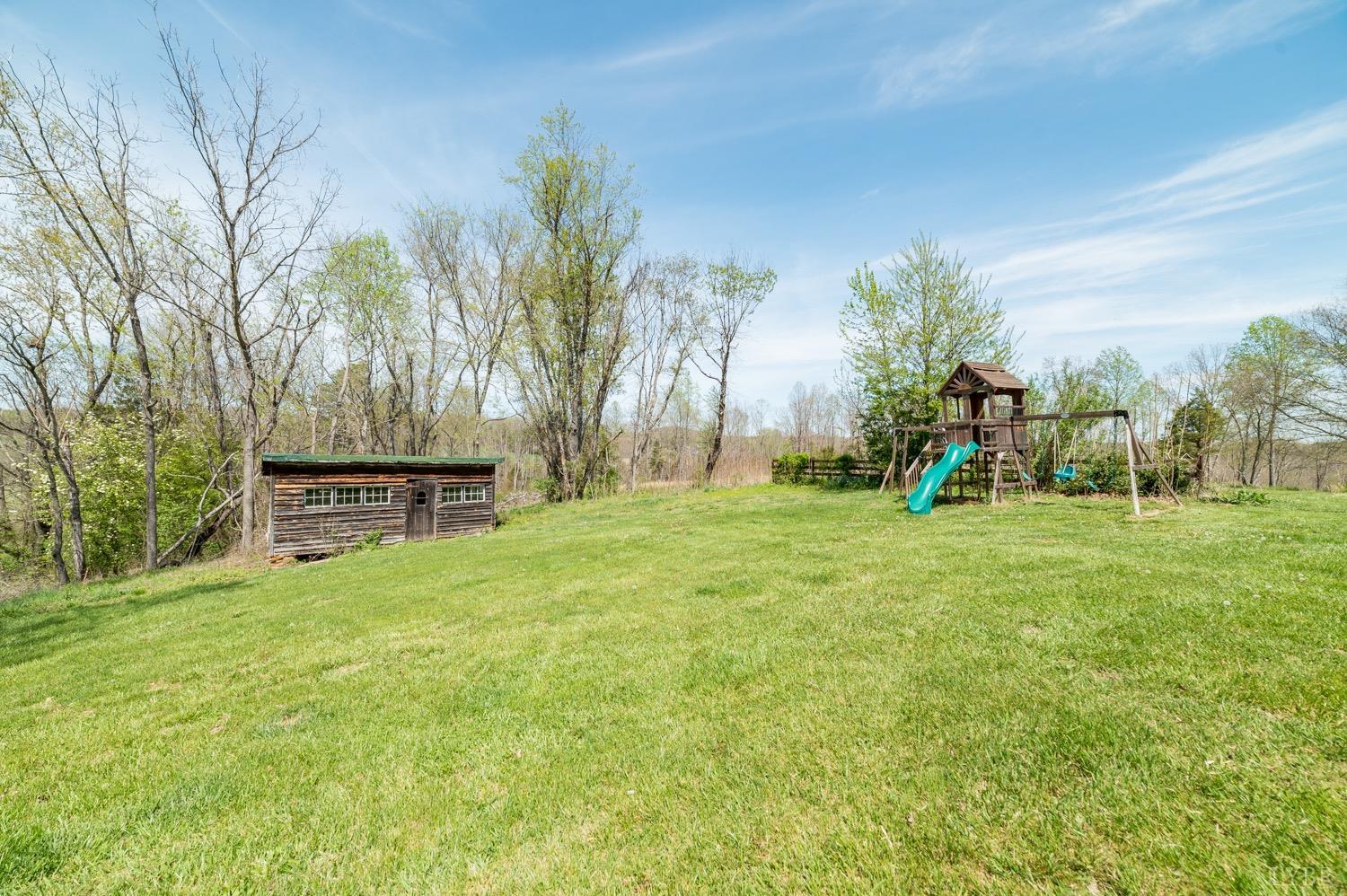 1103 Manley Branch Road Concord, VA 24538 - Photo 51 of 56 a view of a park with swings and slides
