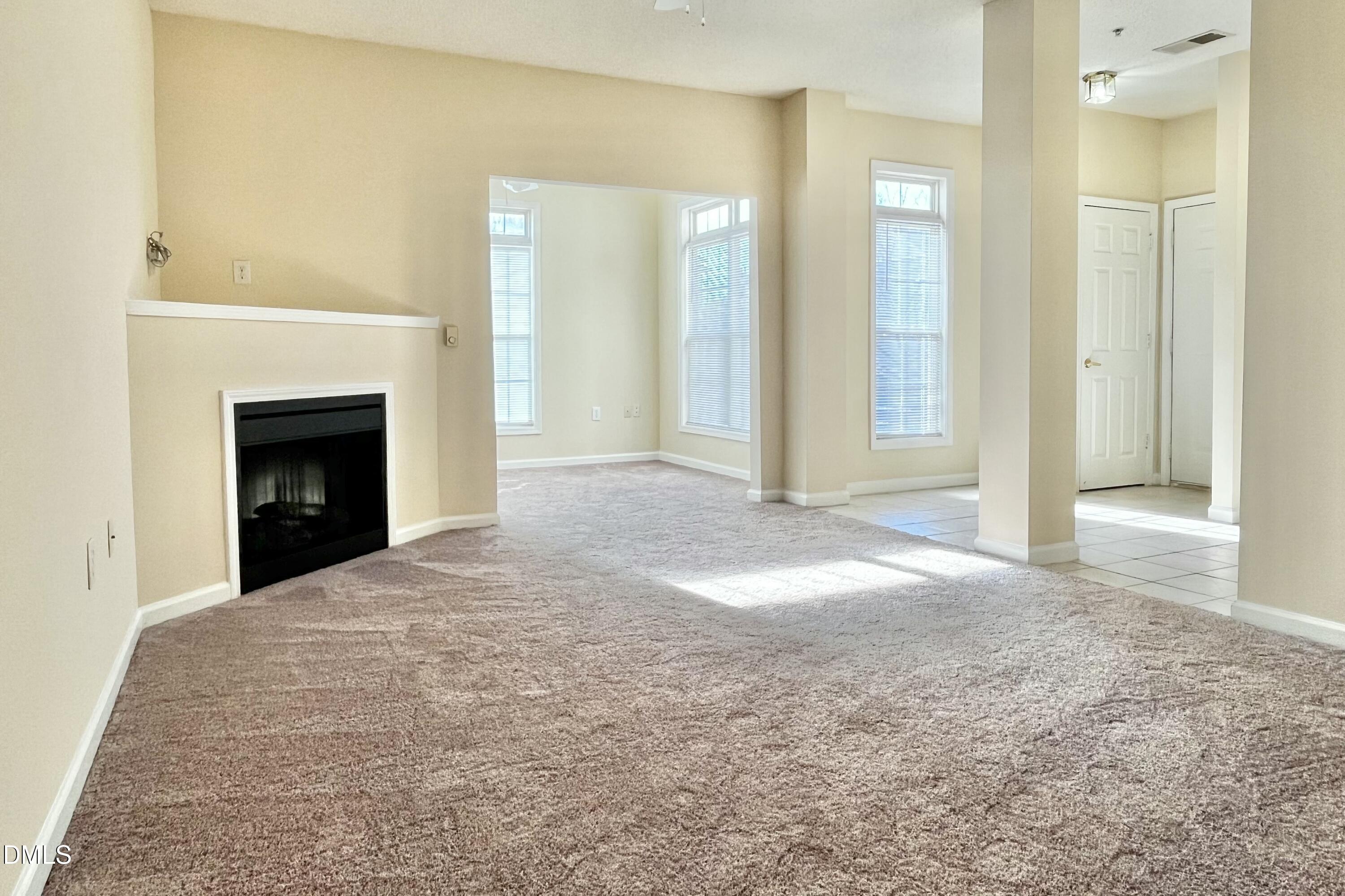2521 Friedland Place, Unit 201 Raleigh, NC 27617 - Photo 13 of 34 a view of a livingroom with a fireplace