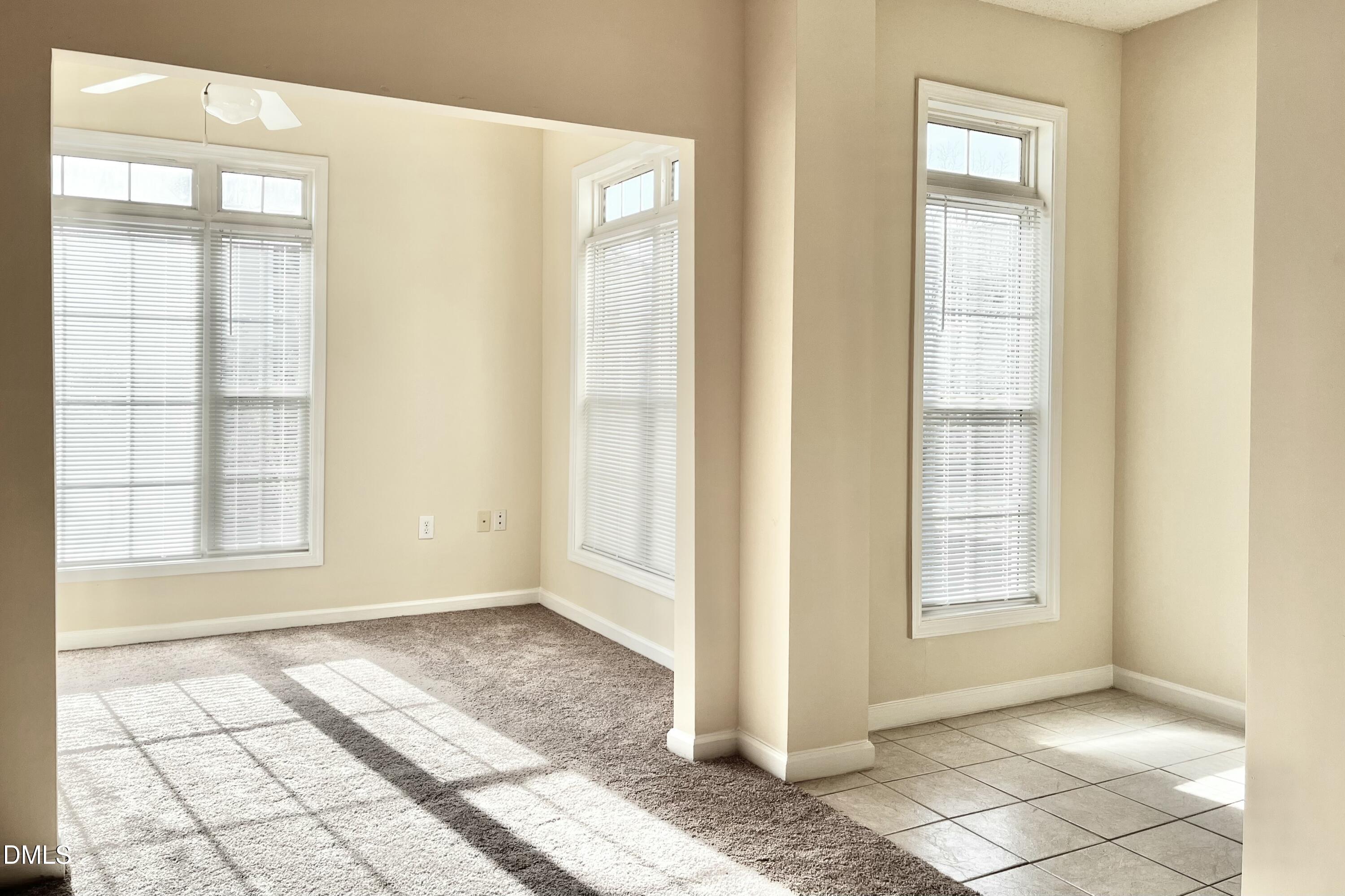 2521 Friedland Place, Unit 201 Raleigh, NC 27617 - Photo 14 of 34 a view of an empty room with windows
