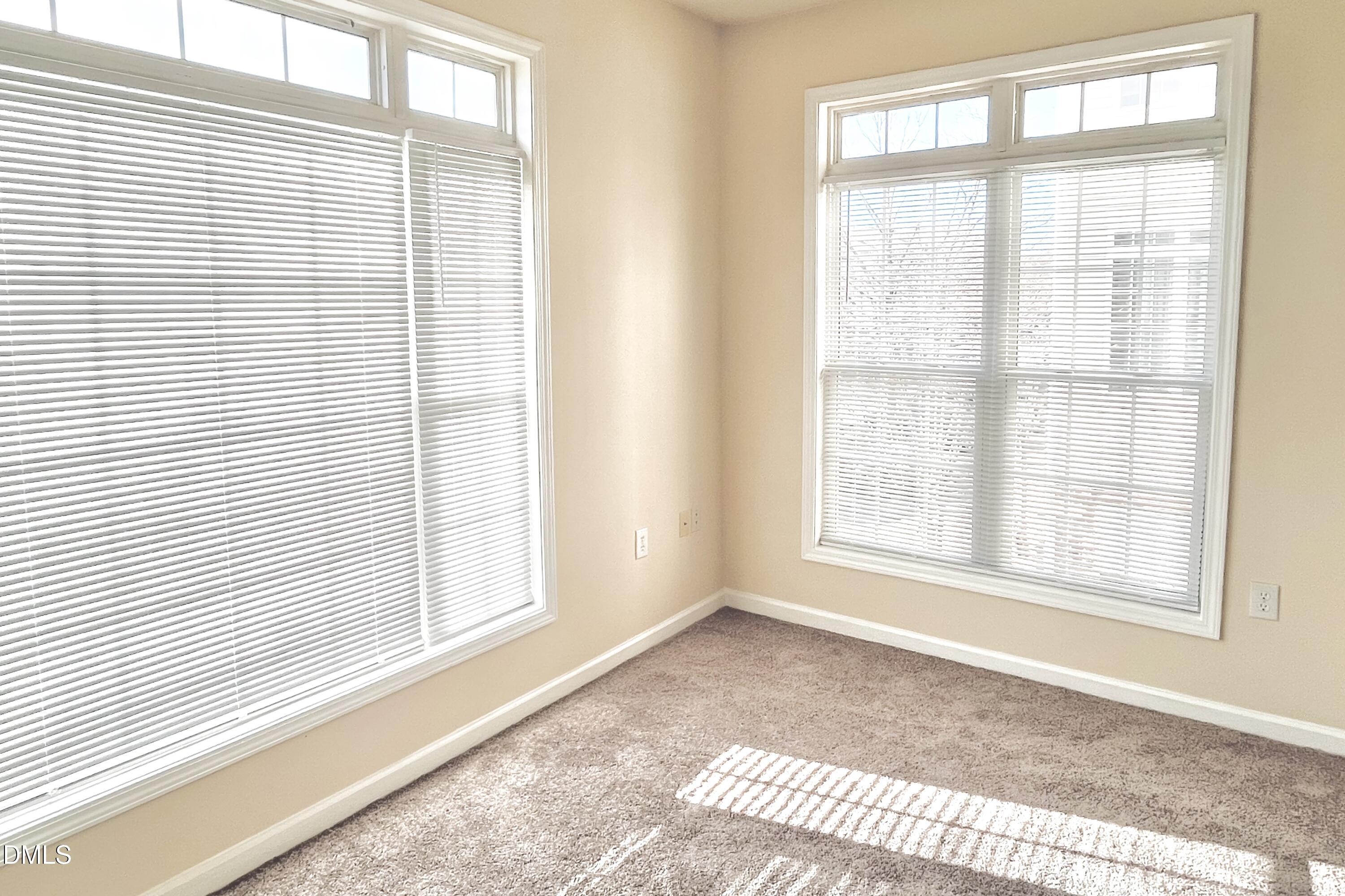 2521 Friedland Place, Unit 201 Raleigh, NC 27617 - Photo 15 of 34 a view of an empty room and a window