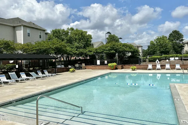 a view of a swimming pool with a patio