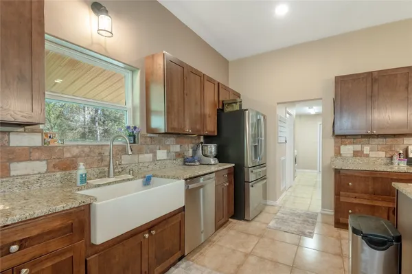 a kitchen with a stove microwave and refrigerator