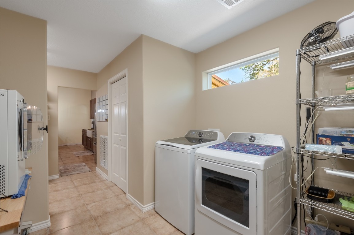 1533 Kickapoo Road Groveton, TX 75845 - Photo 16 of 50 a storage room with a washer and dryer