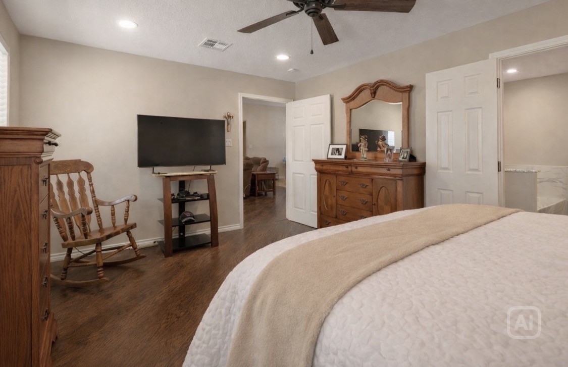 1533 Kickapoo Road Groveton, TX 75845 - Photo 17 of 50 a bedroom with furniture and a flat screen tv