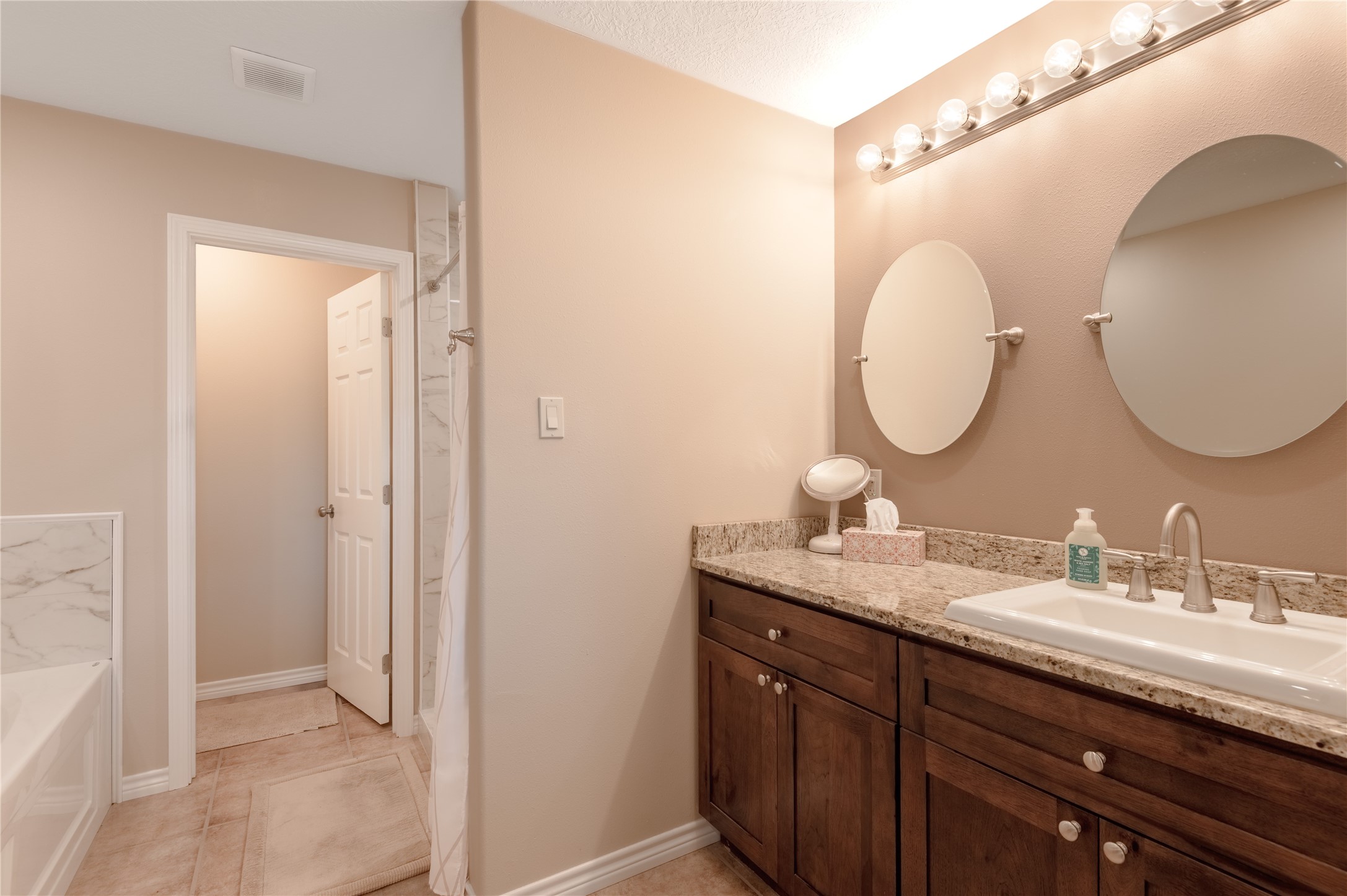 1533 Kickapoo Road Groveton, TX 75845 - Photo 19 of 50 a en suite bathroom with a double vanity sink double and mirror