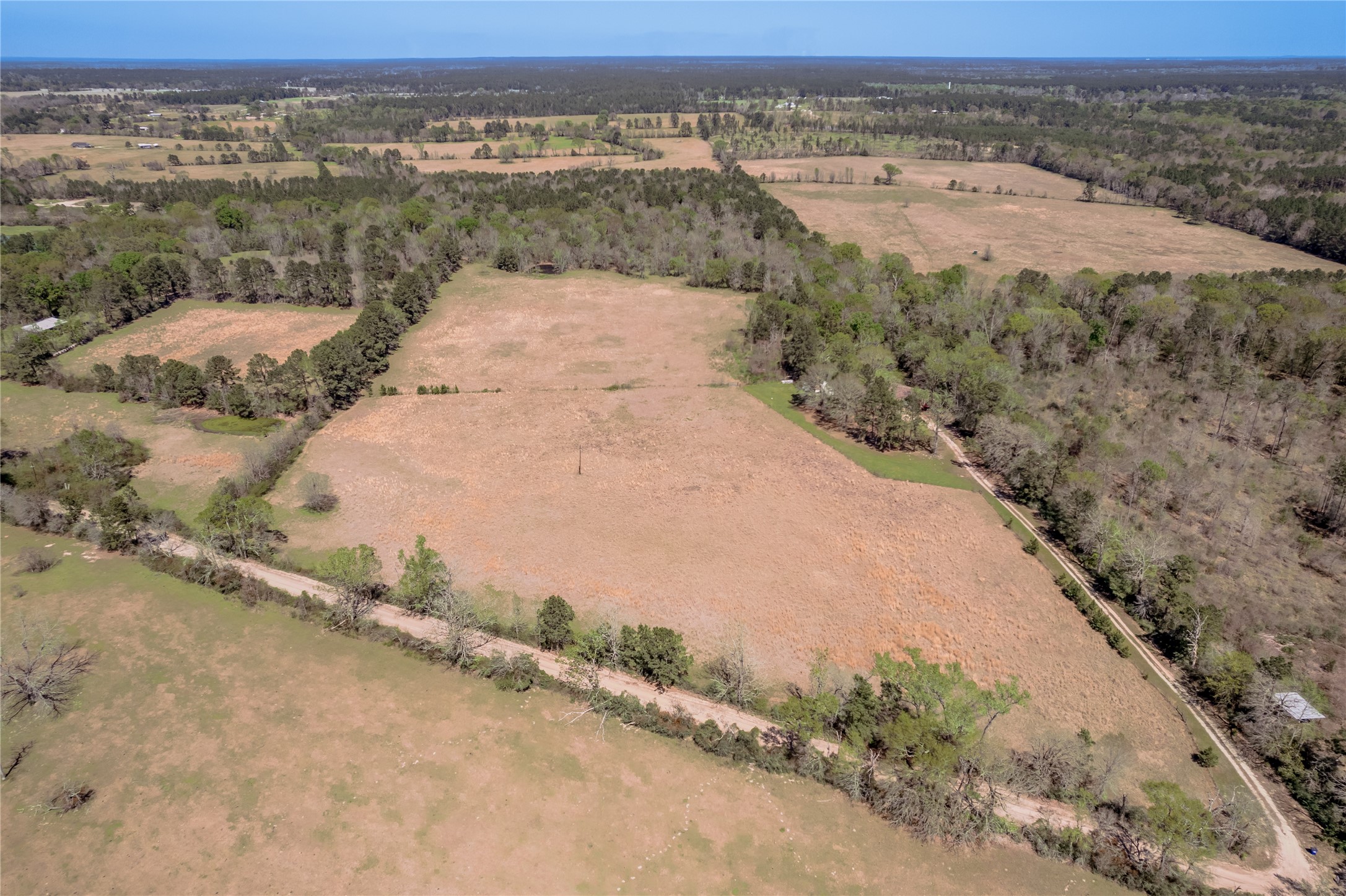 1533 Kickapoo Road Groveton, TX 75845 - Photo 2 of 50 an aerial view of mountain with beach