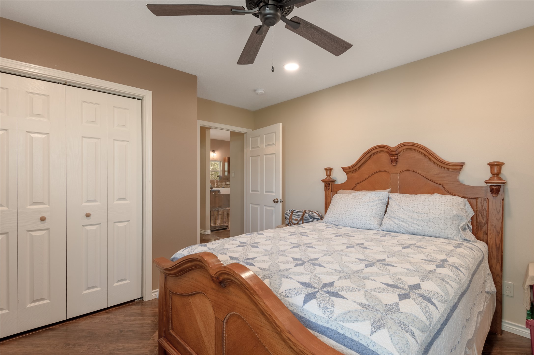 1533 Kickapoo Road Groveton, TX 75845 - Photo 22 of 50 a bedroom with a bed and a chandelier
