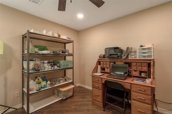 a room with lots of furniture and view of living room
