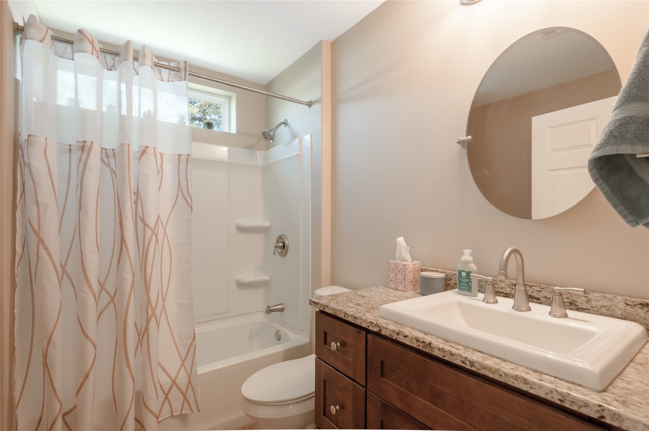 1533 Kickapoo Road Groveton, TX 75845 - Photo 24 of 50 a bathroom with a granite countertop sink and a mirror