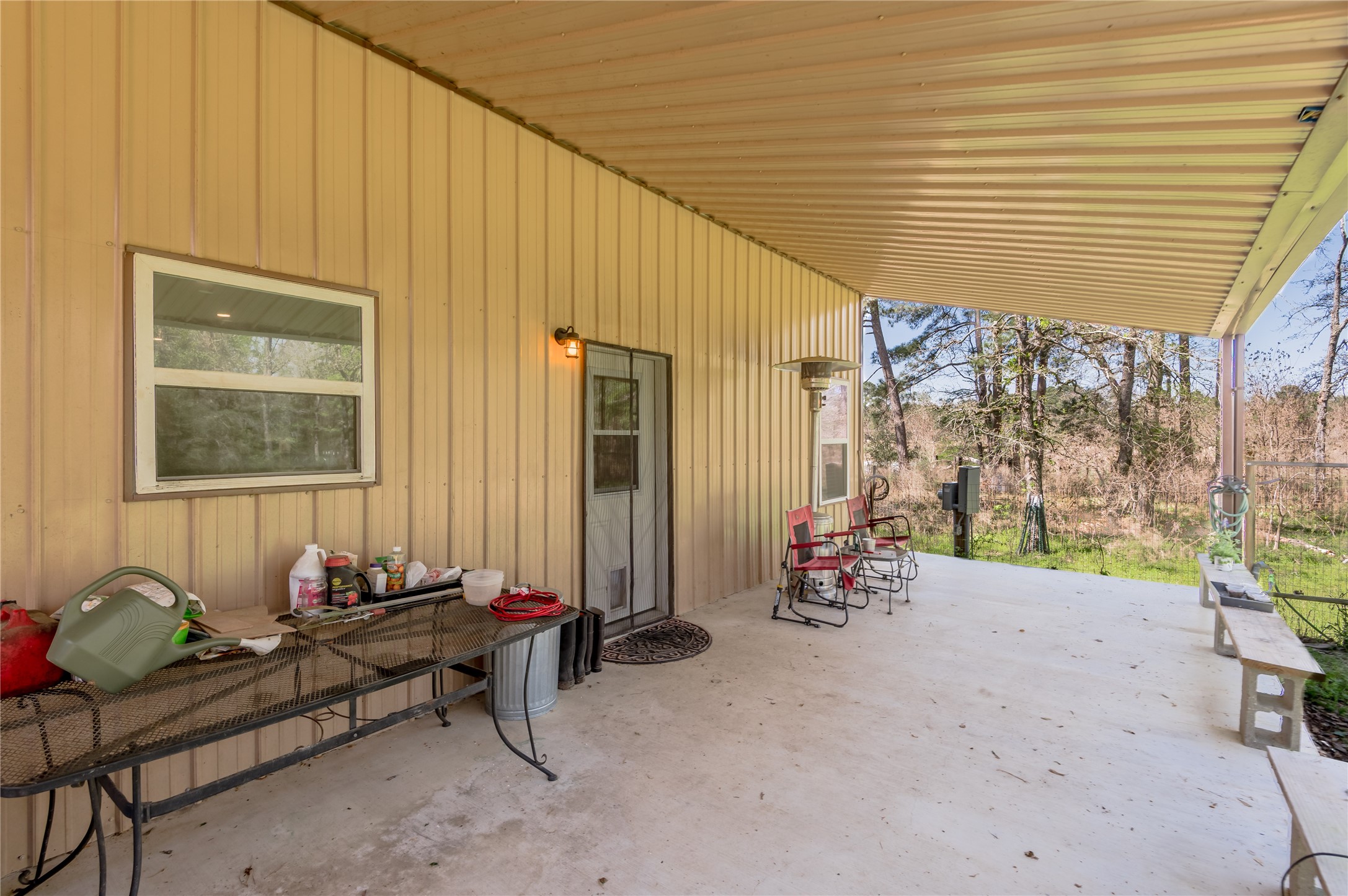 1533 Kickapoo Road Groveton, TX 75845 - Photo 30 of 50 a backyard of a house with table and chairs