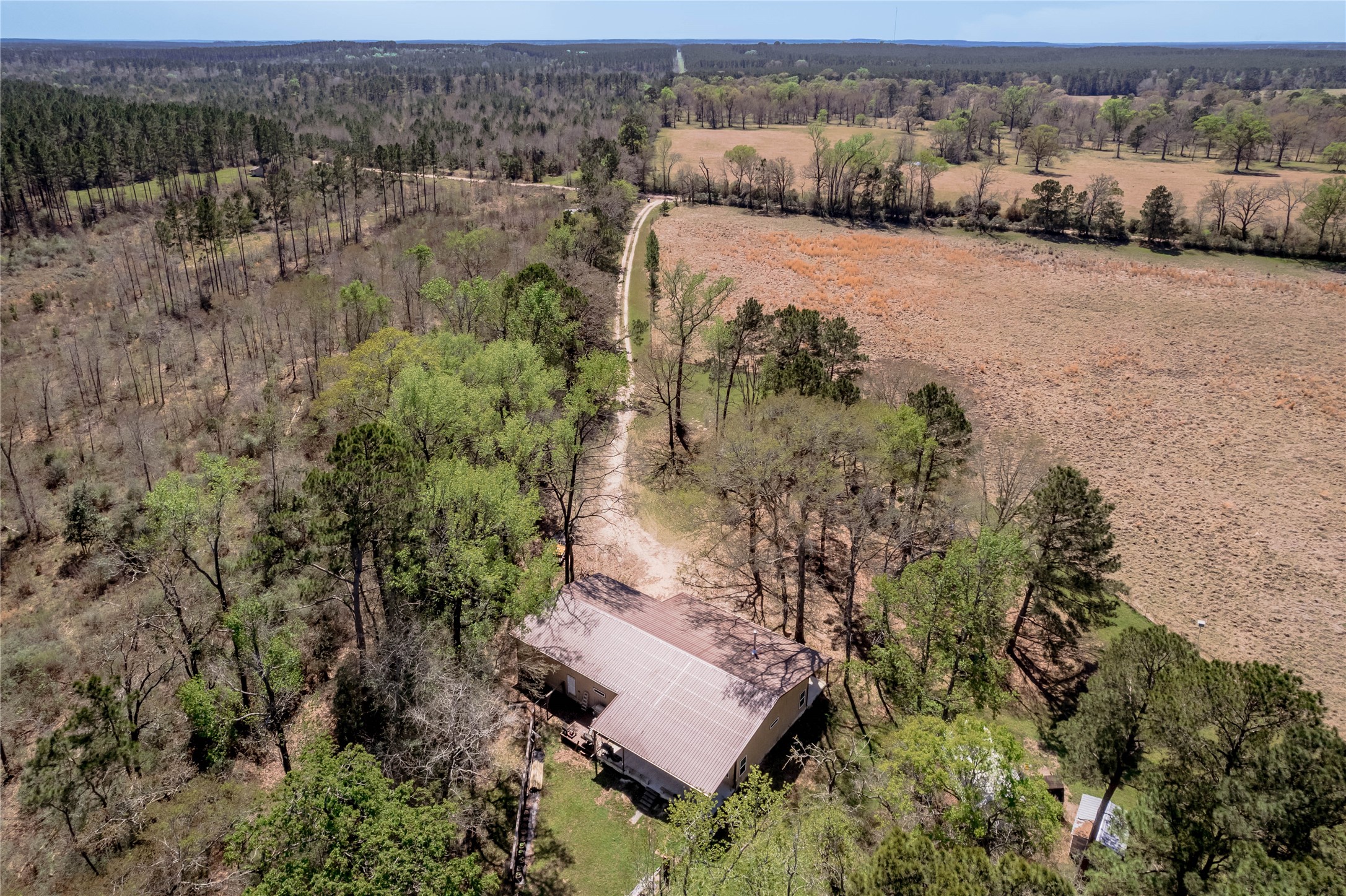 1533 Kickapoo Road Groveton, TX 75845 - Photo 35 of 50 an aerial view of mountain with residential house and green space